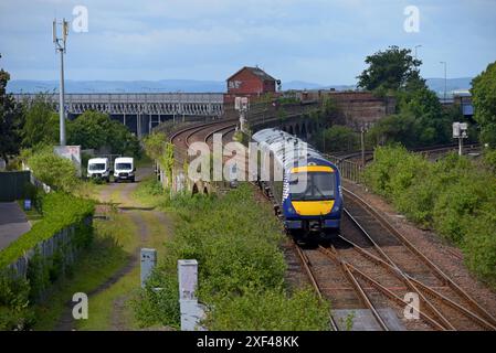 Scotrail train leaving the approach to the Tay river bridge, approaching Dundee Railway Station, June 2024 Stock Photo