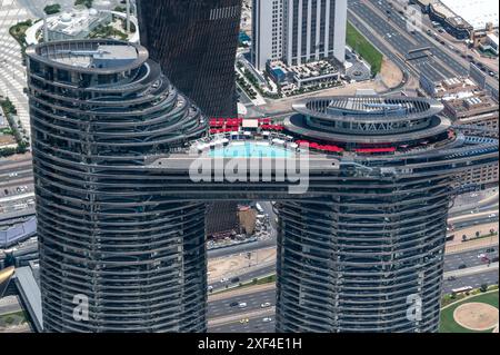 High view from Burj Khalifa, the world’s tallest tower facing the high luxury Address Sky View Hotel with its high infinity pool connected by two cont Stock Photo