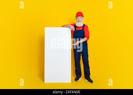 Photo of artisan architect demonstrate smart phone board booking construction restoration isolated vivid color background Stock Photo