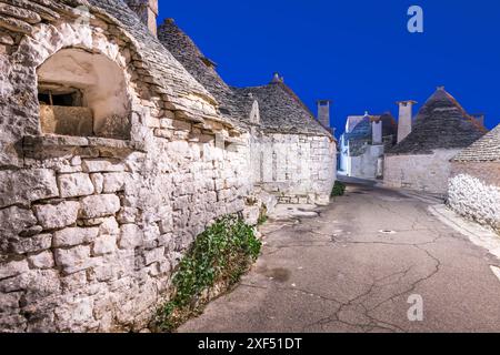 Alberobello, Italy with trulli houses at night. Stock Photo