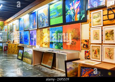 Hoi An (Hoian), Vietnam - April 11, 2018: Awesome paintings in art shop of Hoi An Ancient Town. Hoi An is a popular tourist destination of Asia. Stock Photo