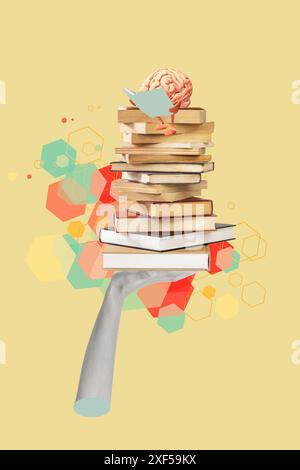 A hand holding books with a brain reading on the top on a colored background with copy space Stock Photo