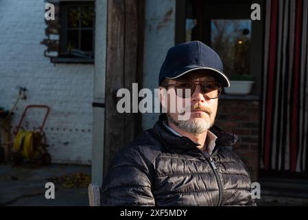 Casual outdoor portrait of a 48 yo white man wearing glasses and a beard, Borchtlombeek, Flanders, Belgium. Model released Stock Photo