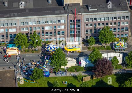 Aerial view, Himmelfahrtskirmes on the Ruhrstraße at the building of the Sparkasse Witten headquarters, carousel and stalls, Witten, Ruhr area, North Stock Photo