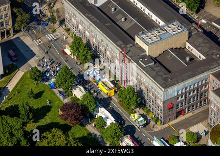 Aerial view, Himmelfahrtskirmes on the Ruhrstraße at the building of the Sparkasse Witten main office, carousel and stalls, Witten, Ruhr area, North R Stock Photo