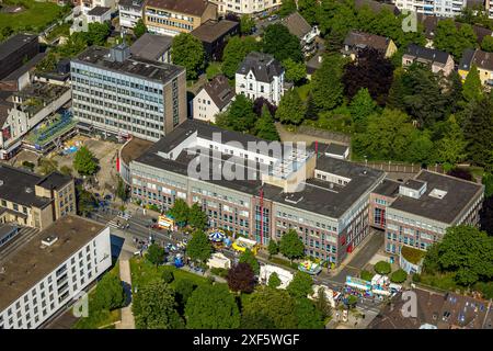 Aerial view, Himmelfahrtskirmes on the Ruhrstraße at the building of the Sparkasse Witten main office, tax office building, carousel and stalls, Witte Stock Photo