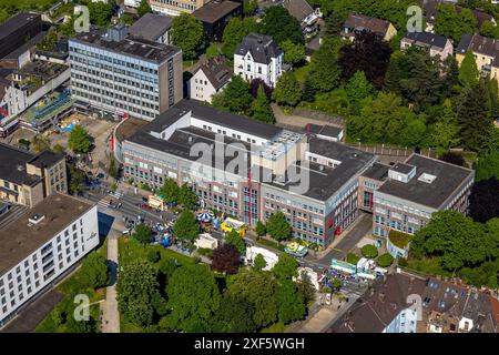 Aerial view, Himmelfahrtskirmes on the Ruhrstraße at the building of the Sparkasse Witten main office, tax office building, carousel and stalls, Witte Stock Photo