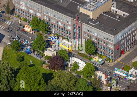 Aerial view, Himmelfahrtskirmes on the Ruhrstraße at the building of the Sparkasse Witten headquarters, carousel and stalls, Witten, Ruhr area, North Stock Photo