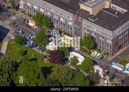 Aerial view, Himmelfahrtskirmes on the Ruhrstraße at the building of the Sparkasse Witten headquarters, carousel and stalls, Witten, Ruhr area, North Stock Photo