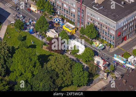 Aerial view, Himmelfahrtskirmes on the Ruhrstraße at the building of the Sparkasse Witten main office, carousel and stalls, Witten, Ruhr area, North R Stock Photo