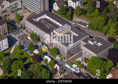 Aerial view, Himmelfahrtskirmes on the Ruhrstraße at the building of the Sparkasse Witten headquarters, carousel and stalls, Witten, Ruhr area, North Stock Photo