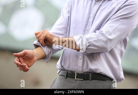 Businessman rolling up the shirt business center. San Sebastian Technology Park. Donostia. Gipuzkoa. Basque Country. Spain. Stock Photo