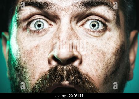 Closeup portrait of surprised builder, architect, contractor or engineer in construction helmet. Building, construction, industry and mining concept. Stock Photo