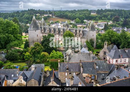 Aerial view of Josselin Castle and the surrounding Sainte Croix medieval quarter in Josselin, Brittany, France. The historic castle and charming rooft Stock Photo