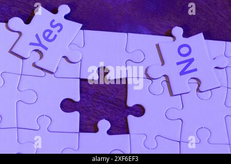 Concept using a puzzle with the word "yes" and "no" on the missing piece. Stock Photo