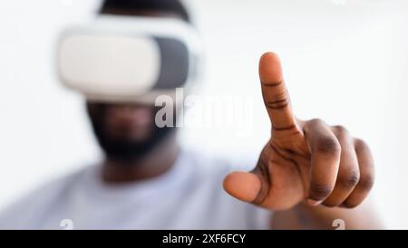 Man Wearing Virtual Reality Headset Interacts With Digital Content Stock Photo