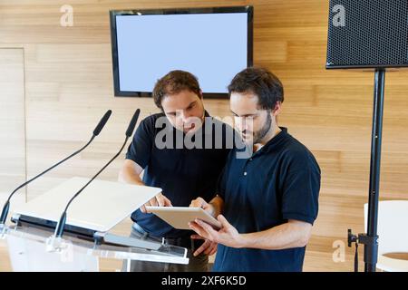 Plasma screen, lectern and sound equipment. Preparation audiovisual conference. Donostia. San Sebastian. Gipuzkoa. Basque Country. Spain. Stock Photo