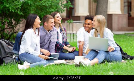 University students studying together on campus ground Stock Photo