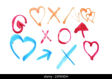 Different symbols drawn by bright spray paints isolated on white, top view Stock Photo