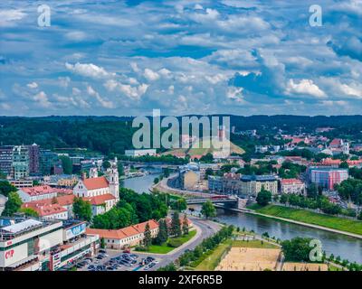 Aerial view of the illuminated Gediminas Tower and modern skyscrapers ...