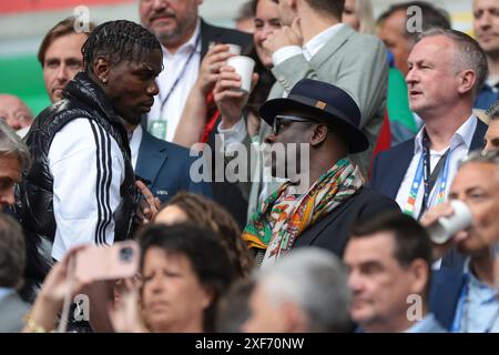 Dusseldorf, Germany. 1st July, 2024. French World Cup winners Paul Pogba and Lilian Thuram discuss in the tribune prior to the UEFA European Championships Round of 16 match at Dusseldorf Arena, Dusseldorf. Picture credit should read: Jonathan Moscrop/Sportimage Credit: Sportimage Ltd/Alamy Live News Stock Photo