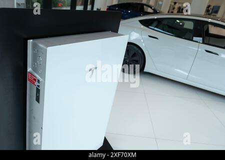 White Model tesla powerwall battery demonstration in official sales salon, popular electric car, American company Elon Musk, electric vehicle producti Stock Photo