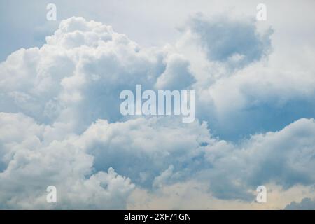 Grey blue sky with white fluffy clouds, natural photography background taken in France Stock Photo