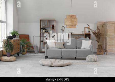 Interior of living room with sofa and glucophone on drawers Stock Photo