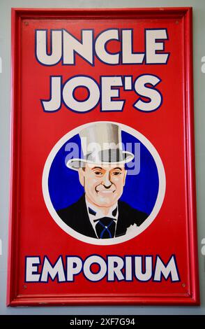 A close up view of a wall sign promoting Uncle Joe's Mint Balls, produced in Wigan, Lancashire U.K. Stock Photo