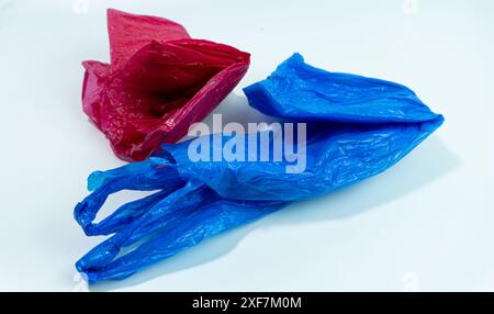 Red plastic bag and blue plastic bag isolated on white background Stock Photo