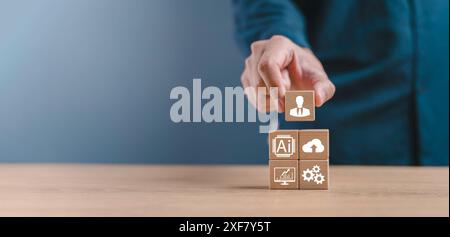 Businessman hand arranging wood block with icon business strategy command and control artificial intelligence (Ai), new technology for business. Futur Stock Photo