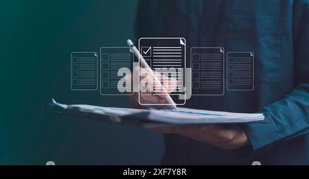 Businessman working on tablet with electronics document icons, E-document management, online documentation digital folder database, paperless office c Stock Photo