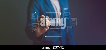 Businessman working on tablet with electronics document icons, E-document management, online documentation digital folder database, paperless office c Stock Photo
