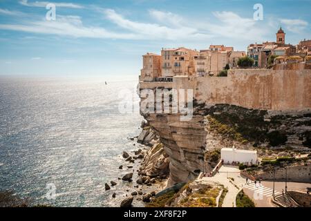 The citadel of Bonifacio in Corsica where houses are perched above the Mediterranean sea on limestone cliffs which have been undercut by the sea and w Stock Photo