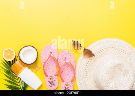 Top view of various seashells placed near colorful fruit and stylish summer accessories on table background. Summer concept. Flat lay. Top view with c Stock Photo