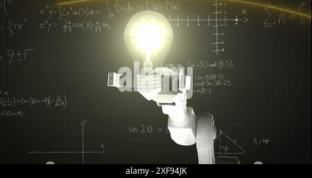 Image of robotic arm holding a glowing bulb against mathematical equations on black background Stock Photo