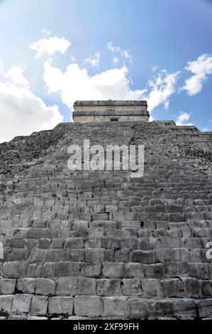 Chichen Itza, UNESCO World Heritage Site, Mexico, Merida, Yucatan, Central America, view upwards to a steep pyramid with striking stairs and a blue Stock Photo