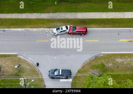 First responders personnel and vehicles responding to car accident site on American street in Florida. Emergency services helping victims of vehicle Stock Photo