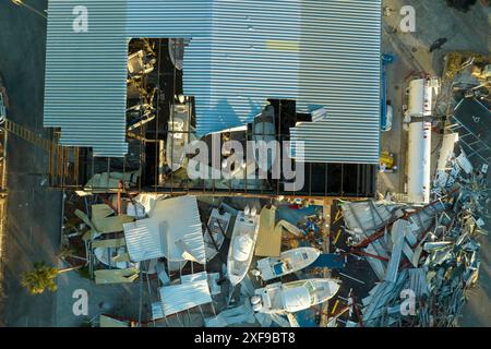 Hurricane Ian destroyed boat station in Florida coastal area. Natural disaster and its consequences. Stock Photo