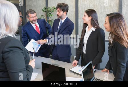 Business people group meeting .Profession businesswomen, businessmen and office workers working in team conference with project planning document on m Stock Photo