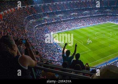 People in Santiago Bernabeu stadium during a football match. Madrid, Spain. Stock Photo