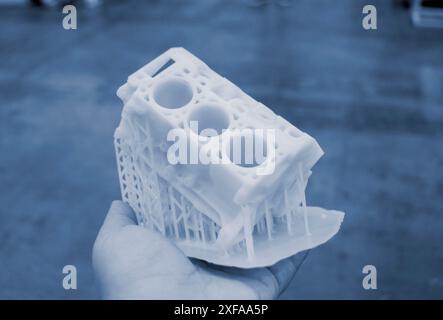 Detailed models in form of internal combustion engine printed on 3D printer from polymer close-up. Detailed object created by 3D printer using 3D printing method. Concept 3D Printing. SLA technology Stock Photo