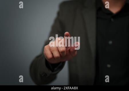 businessman in a suit pointing or fingerprint scan touching Stock Photo