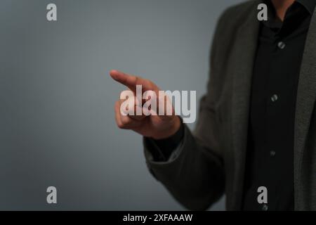 businessman in a suit pointing or fingerprint scan touching Stock Photo