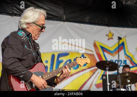 Guildford / UK - Jun 29 2024: Chas Jankel, guitarist and keyboard player with The Blockheads performs on day one of Guilfest music festival, Guildford Stock Photo