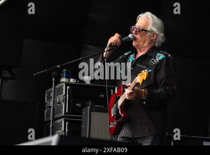 Guildford / UK - Jun 29 2024: Chas Jankel, guitarist and keyboard player with The Blockheads performs on day one of Guilfest music festival, Guildford Stock Photo