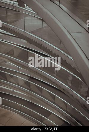 Berlin, Germany - Dec 20, 2023 - A curved walkway stretches in spirals upwards on top inside the glass dome constructed of the Reichstag building. Con Stock Photo