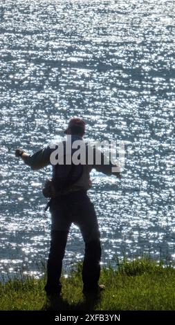 Single man fishing at Abbott Lake near Peaks of the Otter lodge, Blue Ridge Parkway, Virginia. Stock Photo