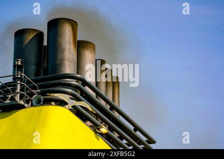 Ship chimney with smoke and seagull flying in Helsinki, Finland Stock Photo