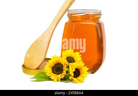 Jar of liquid, Sweet honey in the comb, glass jar on wooden background, Honey from nature pollen flower in glass bottle, Honey jar with wooden honey Stock Photo
